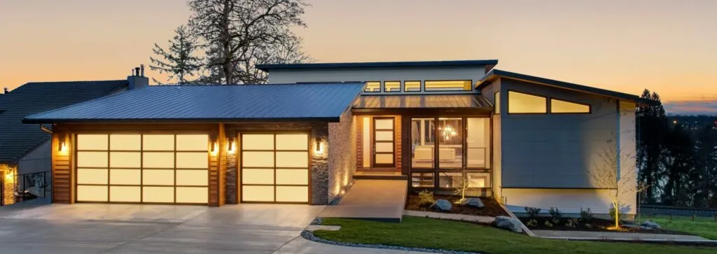 Home lit up with lights at dusk