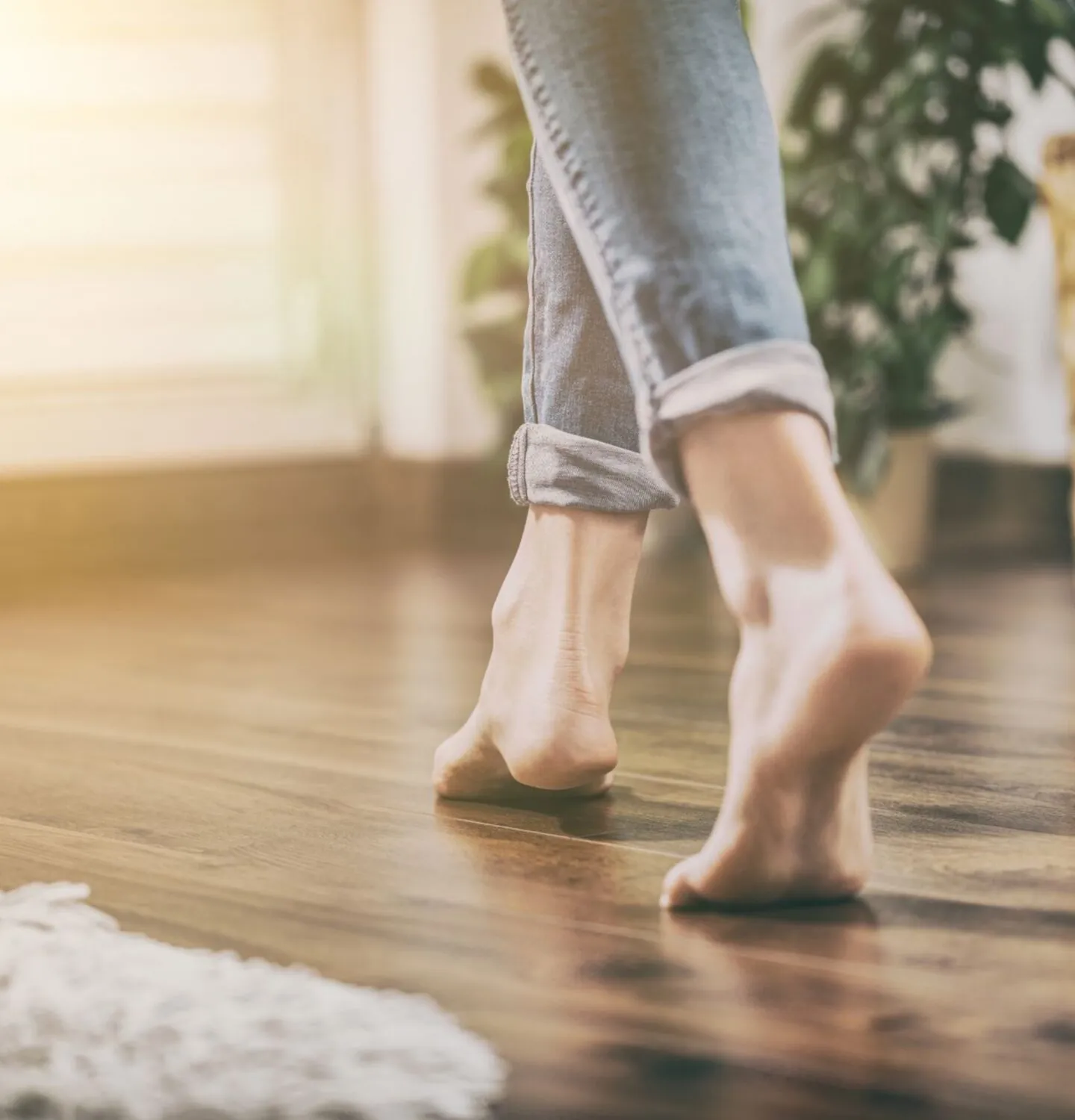 woman walking on wooden flooring