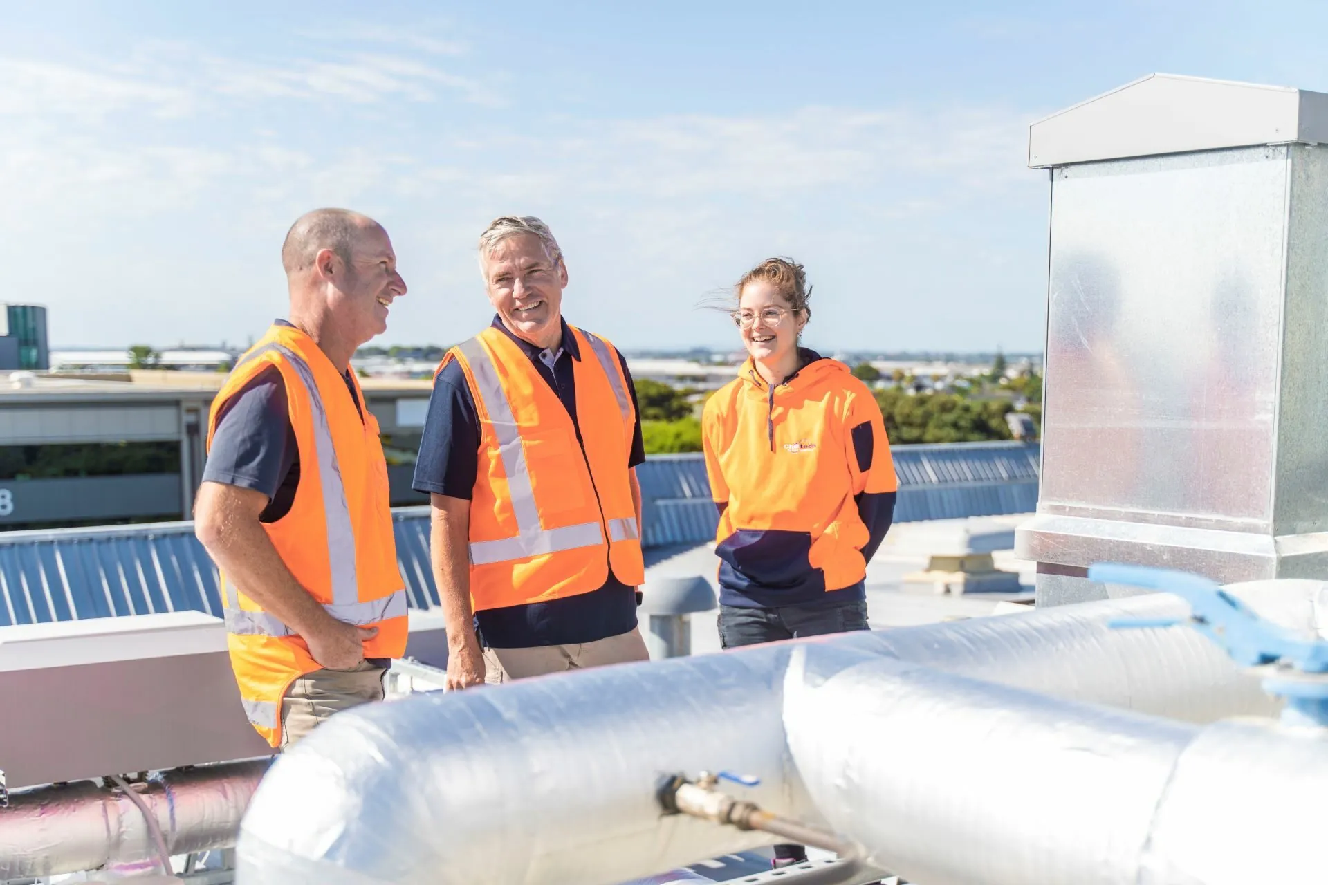 Staff chat while inspecting HVAC plant